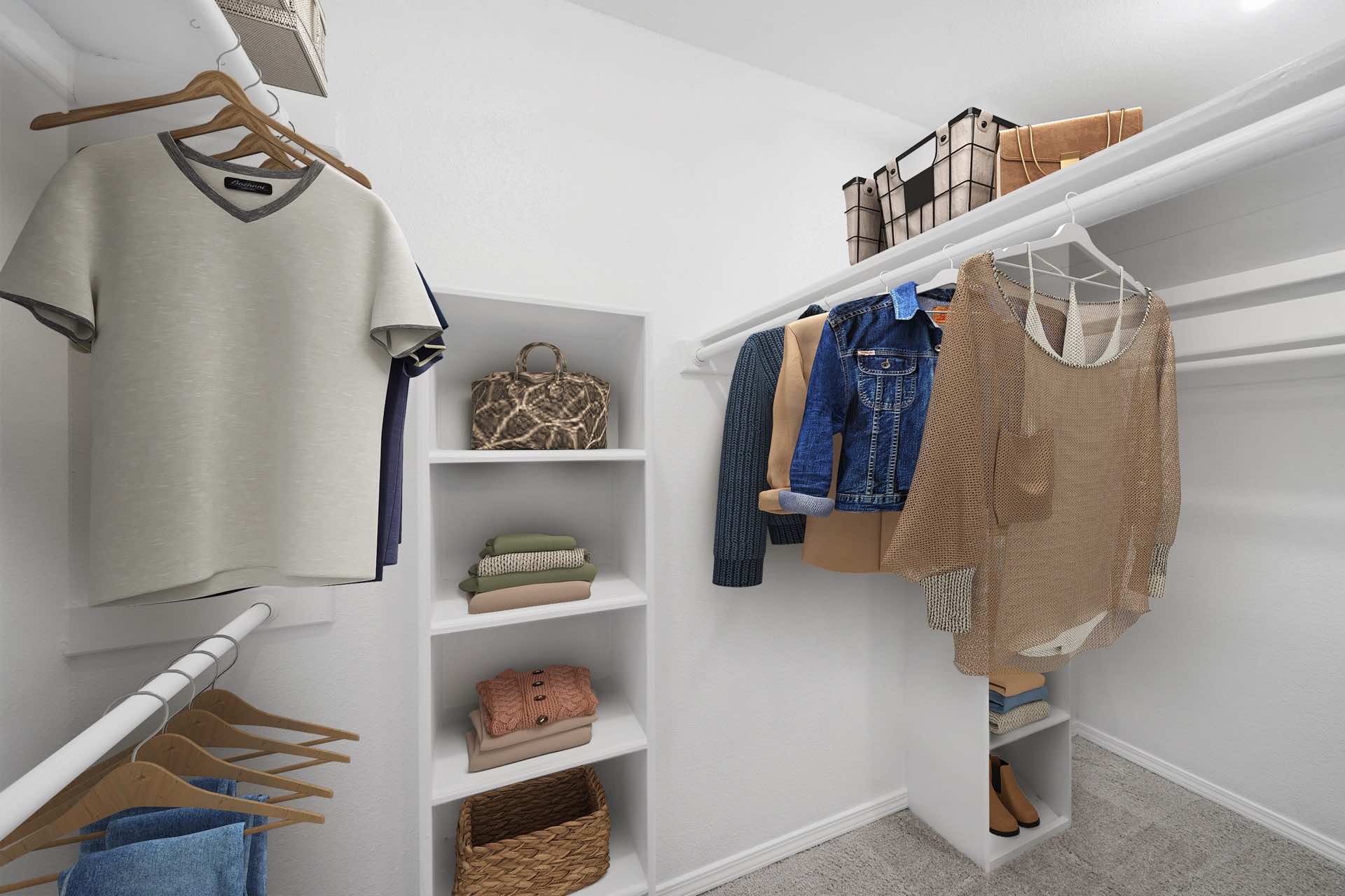 plenty of clothes hanging space and shelving in walk-in closet