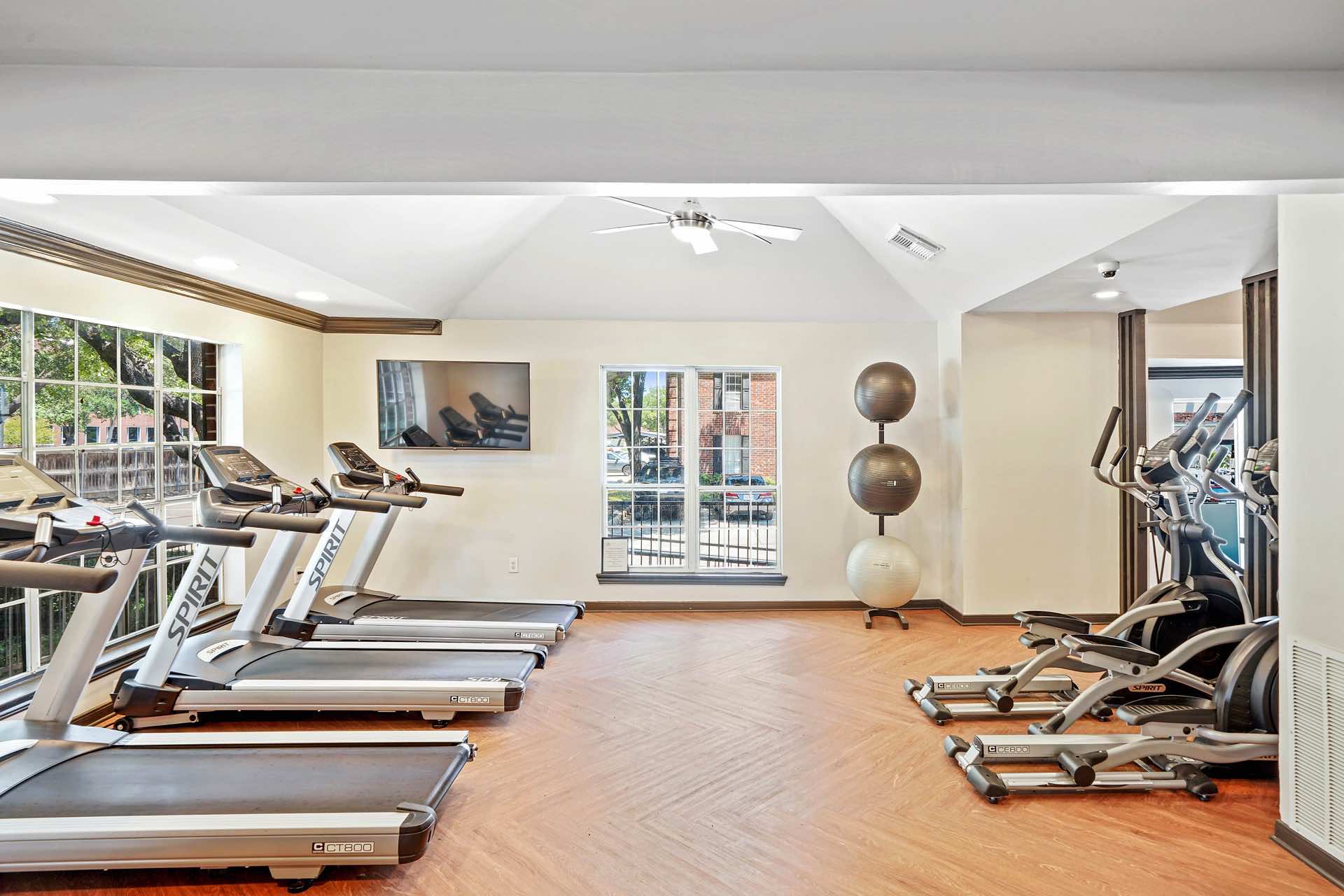 treadmills and medicine balls in fitness center